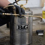 How To Maintain And Clean A B&G Sprayer-a-technician-cleaning-metal-b&g-sprayer-tank
