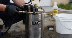 How To Maintain And Clean A B&G Sprayer-a-technician-cleaning-metal-b&g-sprayer-tank