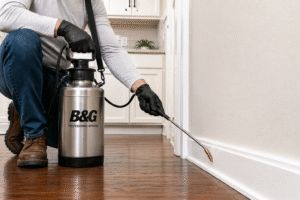 How To Use A B&G Sprayer For Pest Control-technician-using-metal-b&g-sprayer-indoors